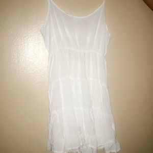 All white sundress with open back with strap.